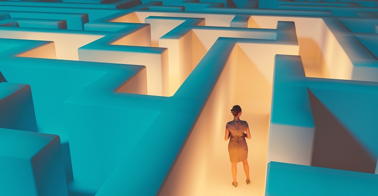 Woman looks for a way to escape a maze.