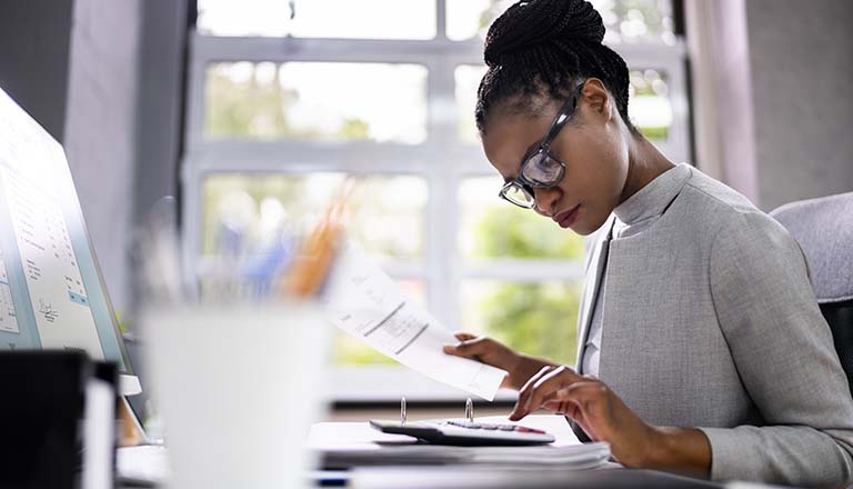 Woman working on business reports