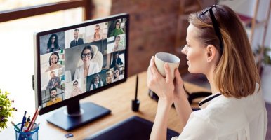 Woman networking with other business people on an Zoom call.